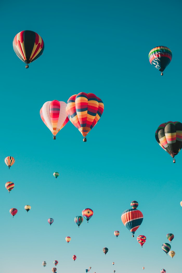 Hot air balloons in a blue sky